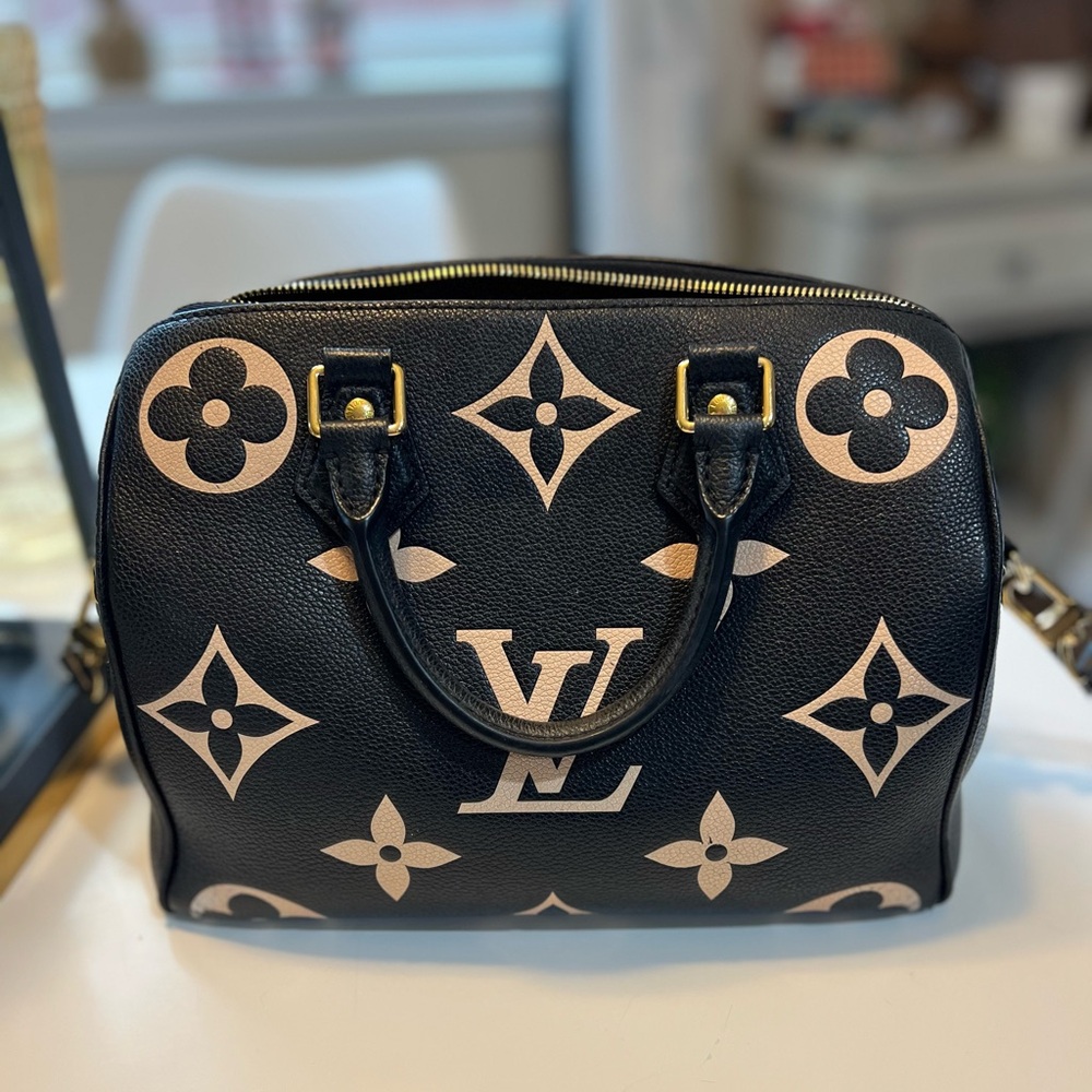 Speedy Bandouliere 25 Bicolor Noir Beige bag.
